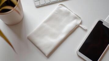 ai generado parte superior ver de un blanco terciopelo bolsa mentiras en un blanco escritorio, con un iphone siguiente a él. generado por artificial inteligencia. foto