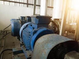 Industrial pump motor induction on water chiller system. photo