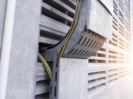 Metal tray cables on the building wall. photo