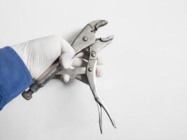 Man's hand holds a locking pliers isolated on white background. photo