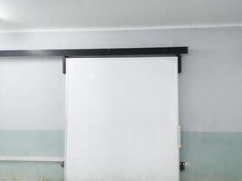 Modern Sliding door on the corridor room. White space for text on board door. photo