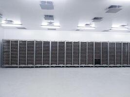 Several trolleys contain hatching eggs in the egg storage room so that the temperature of the eggs is maintained with Ceilling air vent on the cooling storage room before on hatching process. photo