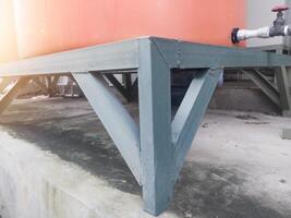 Iron frame stand for water tank storage. photo