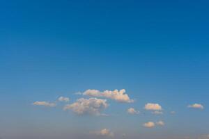 Blue sky and white clouds. Clear cloud in sunshine calm bright winter air background photo