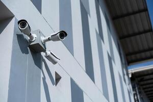 Security surveillance camera in front of office building. CCTV, Closed-circuit television security. photo