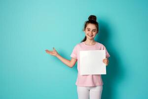 Close up of a girl holding a blank sign in her hand, hand pointing to blank space photo