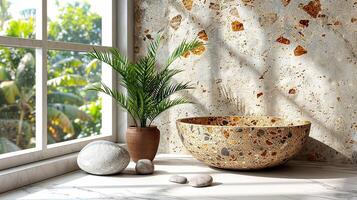 a bowl, a plant and a rock on a counter photo