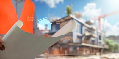 Engineer holding construction blueprint template for building, house, checking accuracy. photo