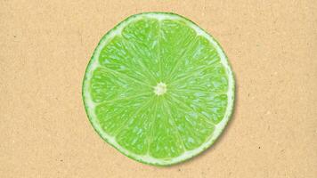 lime fruit slice over paper photo