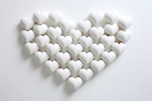 blanco san valentin pared Arte caracteristicas puro corazones arreglado en el forma de un mas grande corazón, simbolizando unidad y amar, Perfecto para moderno decoración o como un pensativo regalo foto