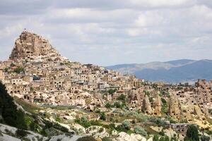 Cappadocia Uchisar Castle is a magnificent view at sunset. Nevsehir,Turkey. photo