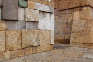 Close-up view of a wall made of several colored natural stones. decor harmony vision. photo