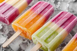 Group of colorful popsicles on ice, closeup photo