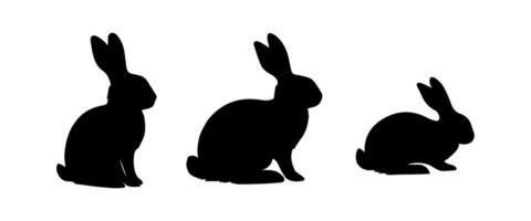 Silhouettes of easter bunnies isolated on a white background. Set of different rabbits silhouettes vector