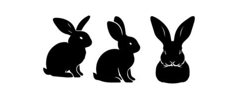 Silhouettes of easter bunnies isolated on a white background. Set of different rabbits silhouettes vector