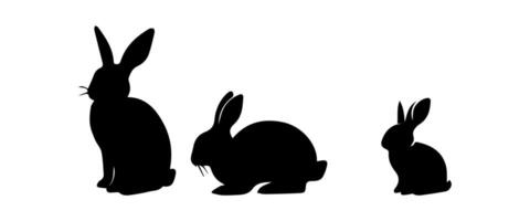 Silhouettes of easter bunnies isolated on a white background. Set of different rabbits silhouettes vector