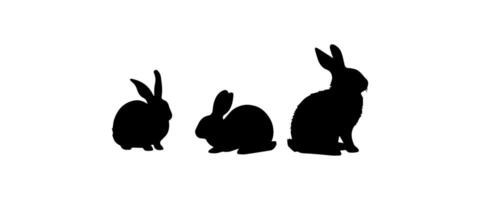 Silhouettes of easter bunnies isolated on a white background. Set of different rabbits silhouettes vector