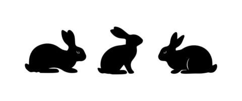 Silhouettes of easter bunnies isolated on a white background. Set of different rabbits silhouettes vector