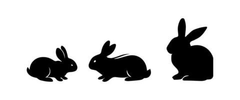 Silhouettes of easter bunnies isolated on a white background. Set of different rabbits silhouettes vector