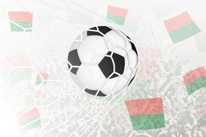 National Football team of Madagascar scored goal. Ball in goal net, while football supporters are waving the Madagascar flag in the background. vector