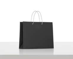 black paper bag on white wooden table, transparent background png