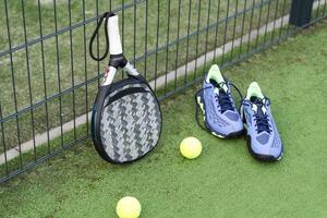 Paddle tennis objects and court. photo