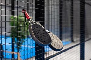 paddle rackets on the playing court photo