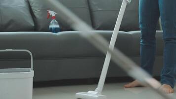 Woman cleaning table using rag and diffuser at home. video