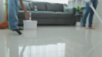 Woman cleaning table using rag and diffuser at home. video