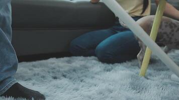 Woman cleaning table using rag and diffuser at home. video