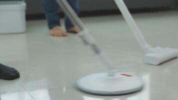 Woman cleaning table using rag and diffuser at home. video