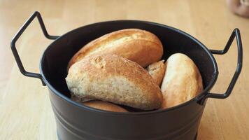 woman hand pick baked bun on table video