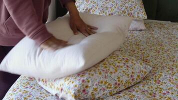 Woman Puts Pillow Into Pillowcase. video