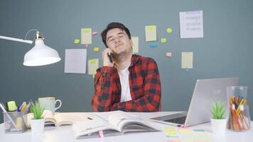 Male student chatting with his girlfriend on the phone. video