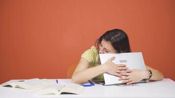 Woman joyfully embracing laptop. video