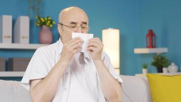 Man covering mouth and nose while sneezing. video