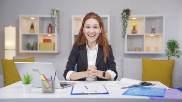 Home office worker woman experiencing joy looking at camera. video