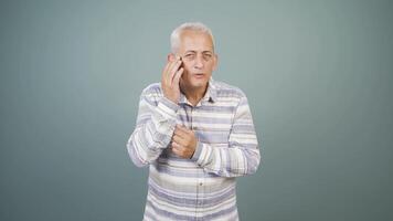 Man with wrinkles and problems on his skin is unhappy. video