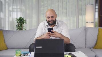 Home office worker man texting. video