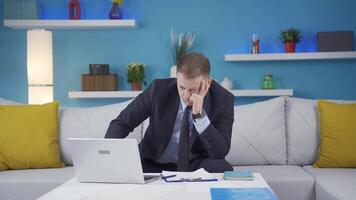 Home office worker man stressed and thoughtful. video