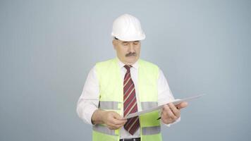 Engineer looking at camera and making positive gesture. video