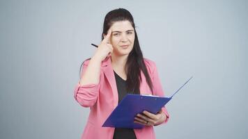 Business woman showing her mind looking at camera. video