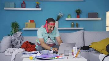 Man working on laptop with funny expression. video