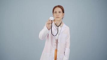 Doctor listening to camera with stethoscope. video