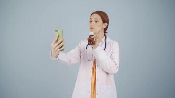 Doctor describing medicine on Facetime. video