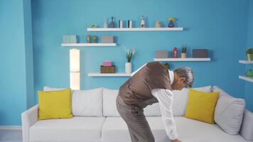 The old man walking around the house. Thoughtful and looks around. video