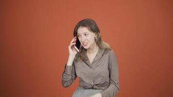 Young woman receiving gospel on the phone. video