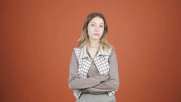 Young woman looking at camera with dull expression. video