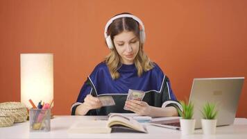 Young woman looking at laptop is unmotivated and bored. video