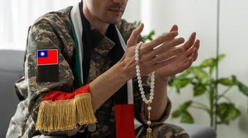 military taiwan with prayer beads photo